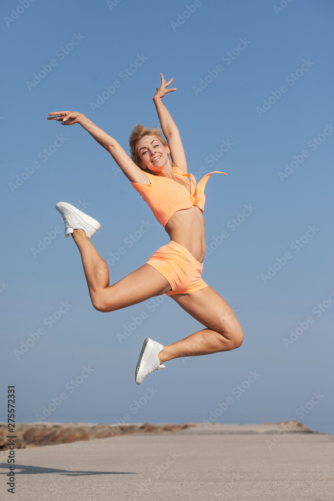 young slim athletic girl in jump