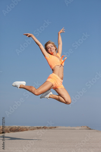 young slim athletic girl in jump