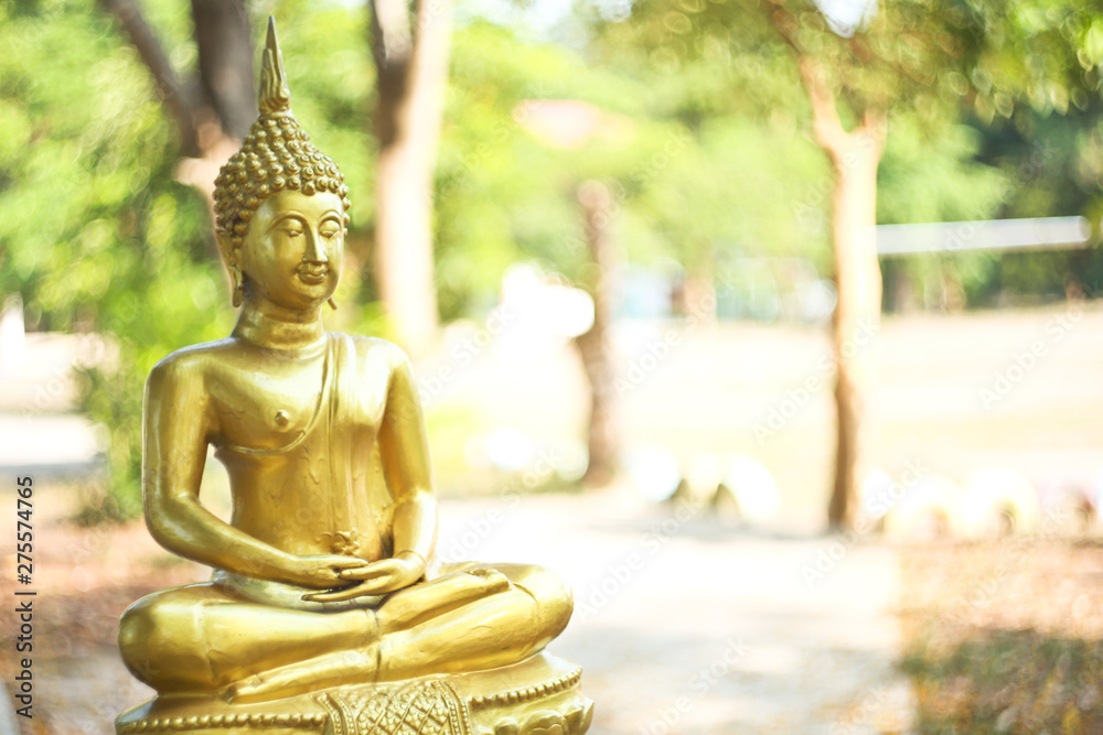 The Lord Buddha Statue color gold on white background.concept buddhist honly day and religious in Buddhism as ,Makhabucha,Visakhabucha and Asarnlahabucha day.selective focus.