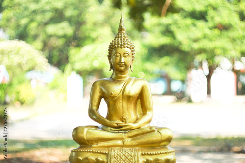 The Lord Buddha Statue color gold on white background.concept buddhist honly day and religious in Buddhism as  Makhabucha Visakhabucha and Asarnlahabucha day.selective focus.