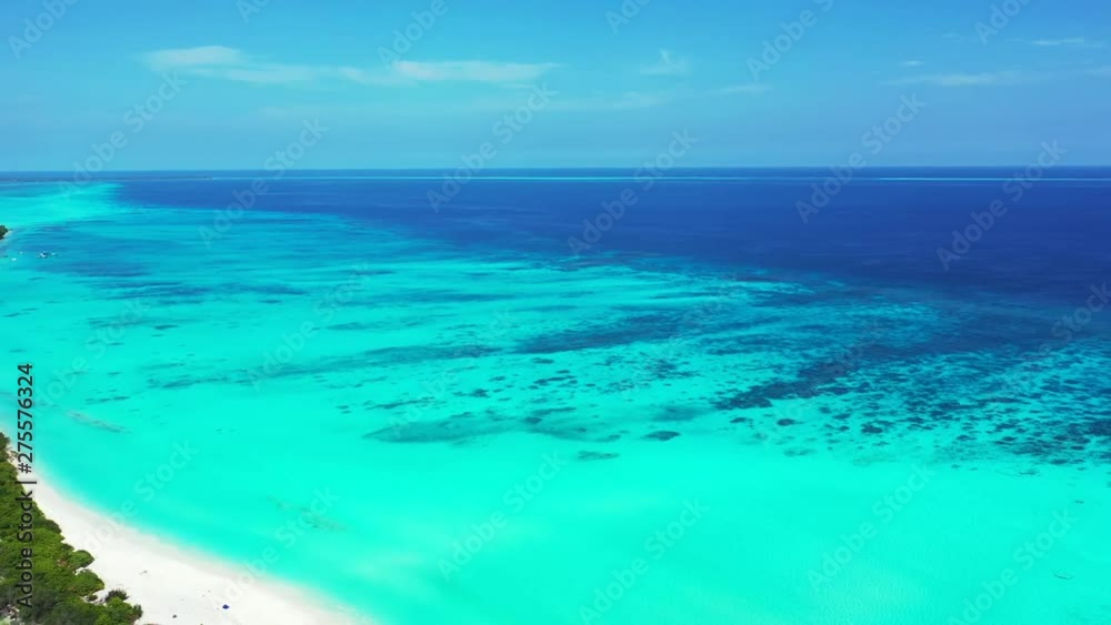 Flying by a tropical island of Barbados. The truck left, revealing the island. Turquoise water. Flying by a tropical island of Barbados. The truck left, revealing the island. Turquoise water.
