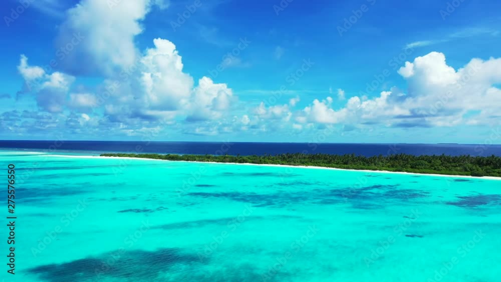 A dramatic sky above Indonesia. Flight towards an exotic island with trees on it. Turquoise water in front of it. Blue water behind it. Dolly in A dramatic sky above Indonesia. Flight towards an exotic island with trees on it. Turquoise water in front of it. Blue water behind it. Dolly in
