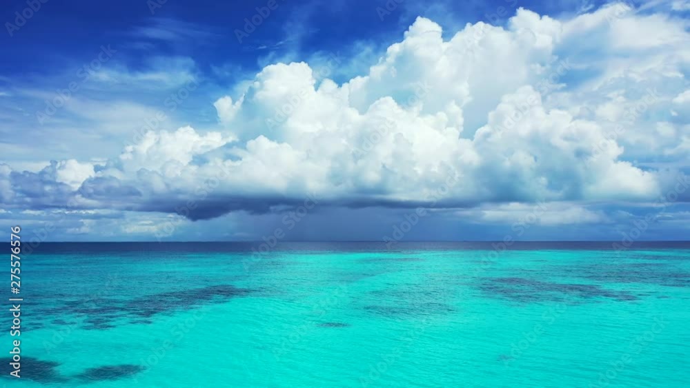 Aeerial view of a dramatic cloudy sky above the turquoise sea in Thailand. Dolly in Aeerial view of a dramatic cloudy sky above the turquoise sea in Thailand. Dolly in