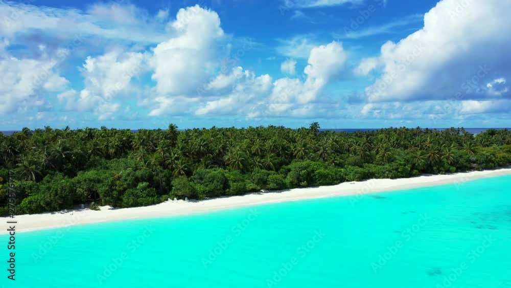 Flight towards an exotic island of Barbados. A forest of palms. With a sandy beach. Turquoise water with a beautiful cloudy sky above. Pan left Flight towards an exotic island of Barbados. A forest of palms. With a sandy beach. Turquoise water with a beautiful cloudy sky above. Pan left