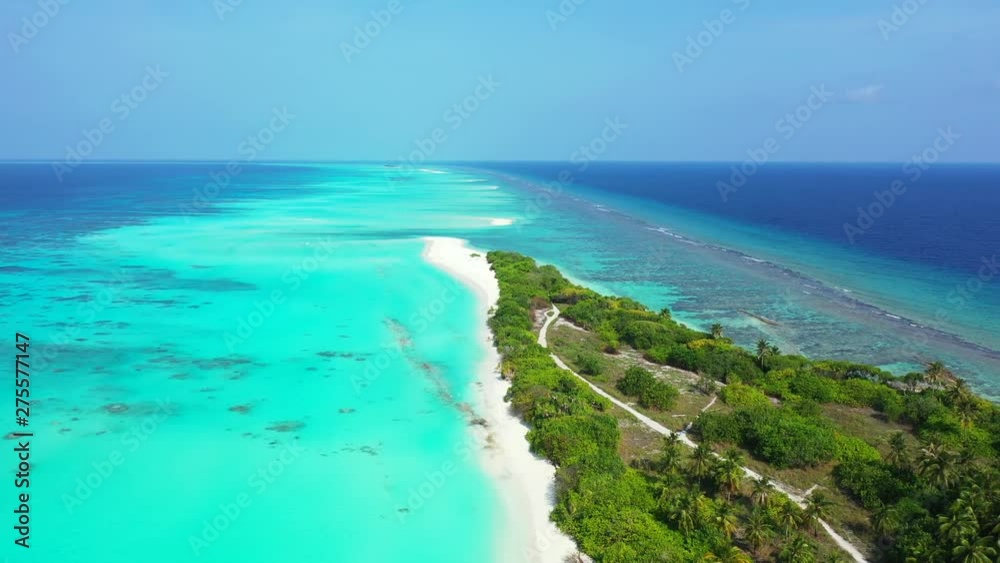Fly over an island with tropical trees and some paths on it. In Barbados. Dolly in Fly over an island with tropical trees and some paths on it. In Barbados. Dolly in