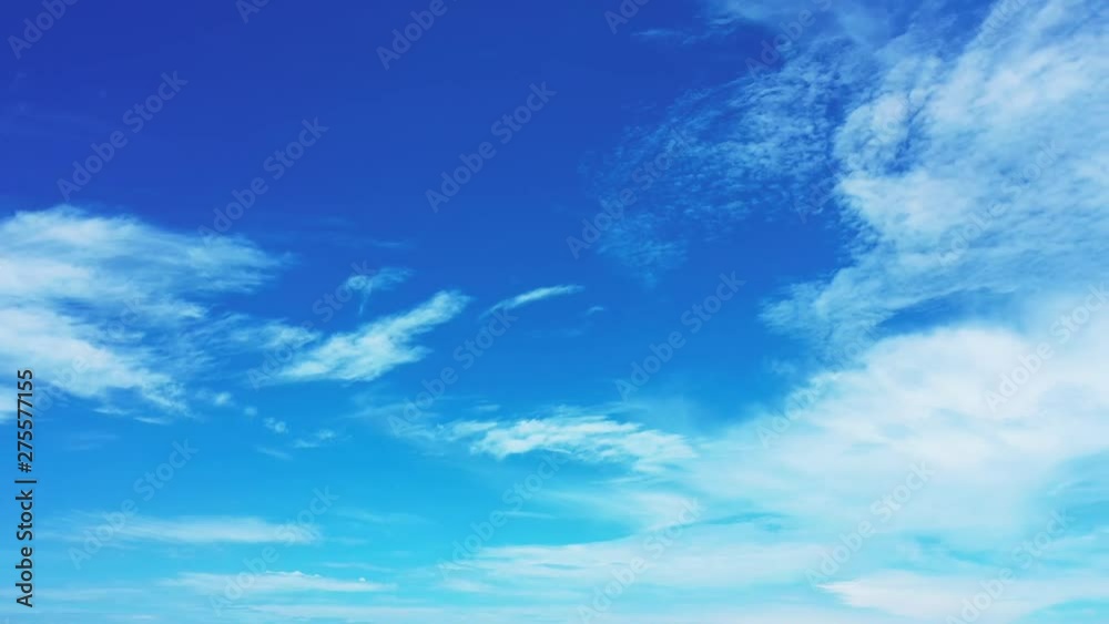 A blue blue sky with cirrostratus clouds in Thailand. Pan right slowy A blue blue sky with cirrostratus clouds in Thailand. Pan right slowy