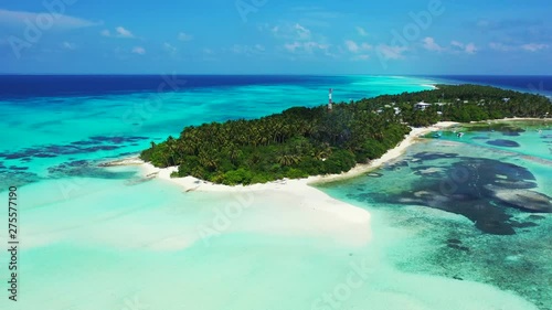 Wallpaper Mural Aerial view of  tropical island with a forest and village on it. turquoise water with reefs in the Seychelles. Dolly out,pedestal up Torontodigital.ca
