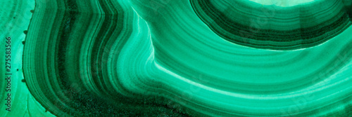 The green malachite. An ornamental stone. Photo texture. Macro.