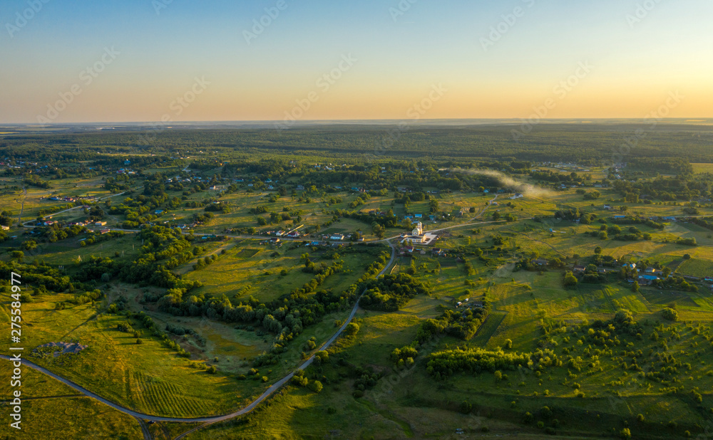 View of the village from the quadcopter in the setting sun