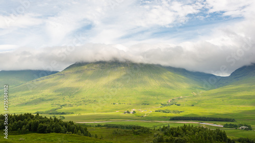 A Scottish Highland Landscape depicting a cloud-capped mountain scene.