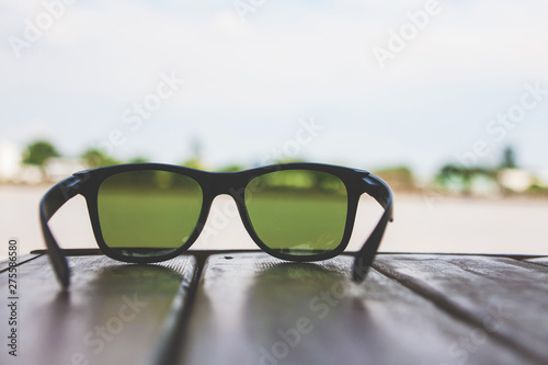 Sunglasses on wood table see view Chao Phraya River