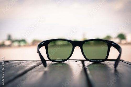 Sunglasses on wood table see view Chao Phraya River