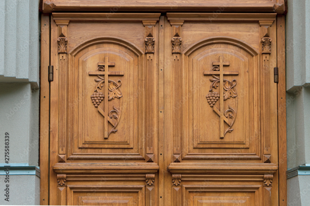 wooden door in Church-close with the crucifixes wooden door in Church-close with the crucifixes