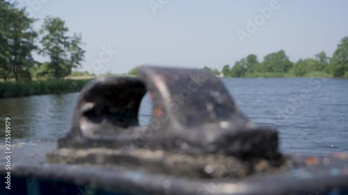 Old black ore mount on a ship. RACK FOCUS, SLOW MOTION photo