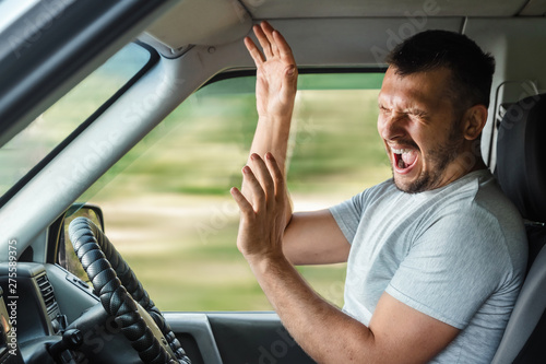 Portrait of a screaming young business man getting into car accident while driving © Aliaksandr Marko