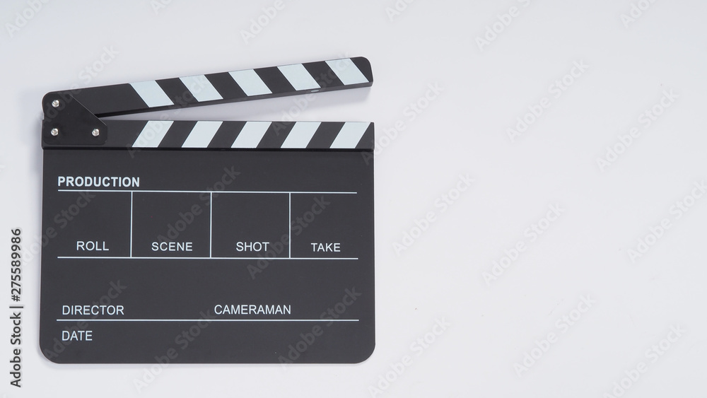 Fototapeta premium Clapperboard or movie slate use in video production, film and cinema industry. It's black color on white paper background.