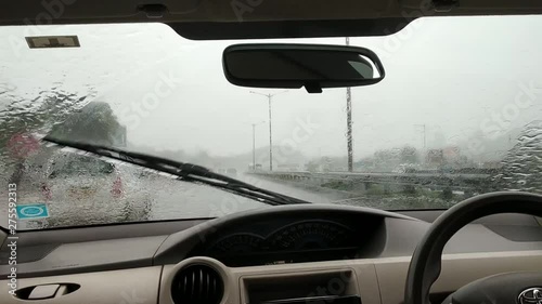 Car on the road with heavy rain