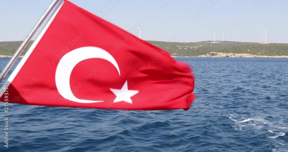 Turkish flag on a background of blue sea and sky