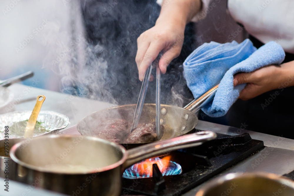 Chef preparing food in the kitchen, chef cooking, Chef decorating dish Chef preparing food in the kitchen, chef cooking, Chef decorating dish