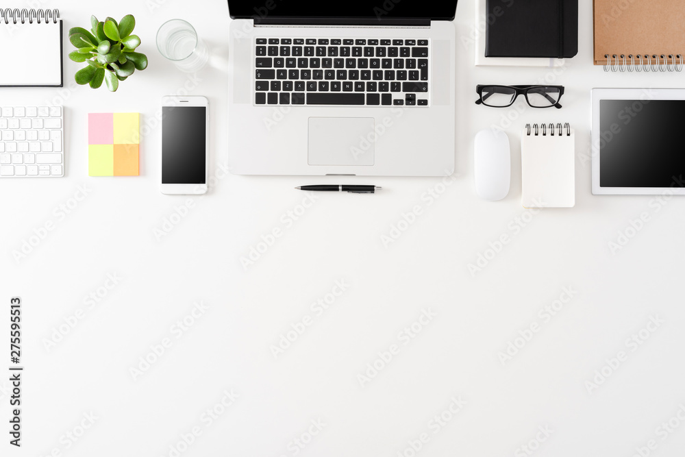 Modern office desktop with laptop and accessories Modern office desktop with laptop and accessories