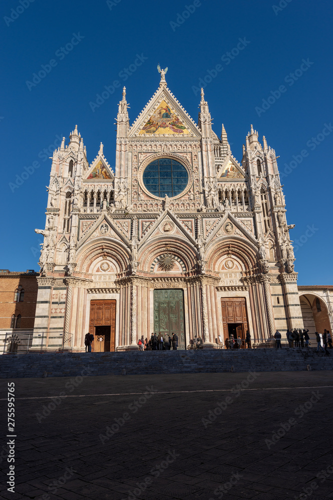 Facade of the Siena Cathedral, Santa Maria Assunta 1220-1370 with clear blue sky. Tuscany, Italy, Europe
