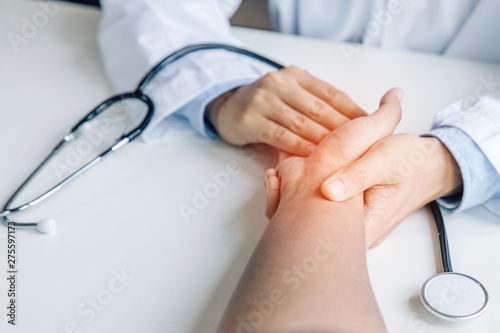 Fototapeta Naklejka Na Ścianę i Meble -  Doctor holds hands and leaves comforting counselors to patient.