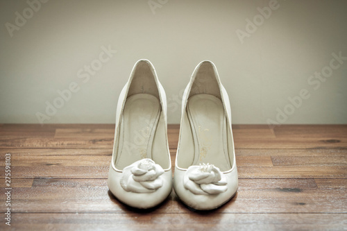 Bridal wedding shoes on wooden background