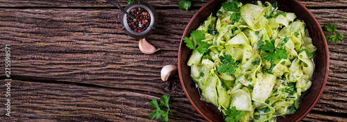 Salad of marinated zucchini in spices. Vegan food. Healthy meal. Banner. Top view