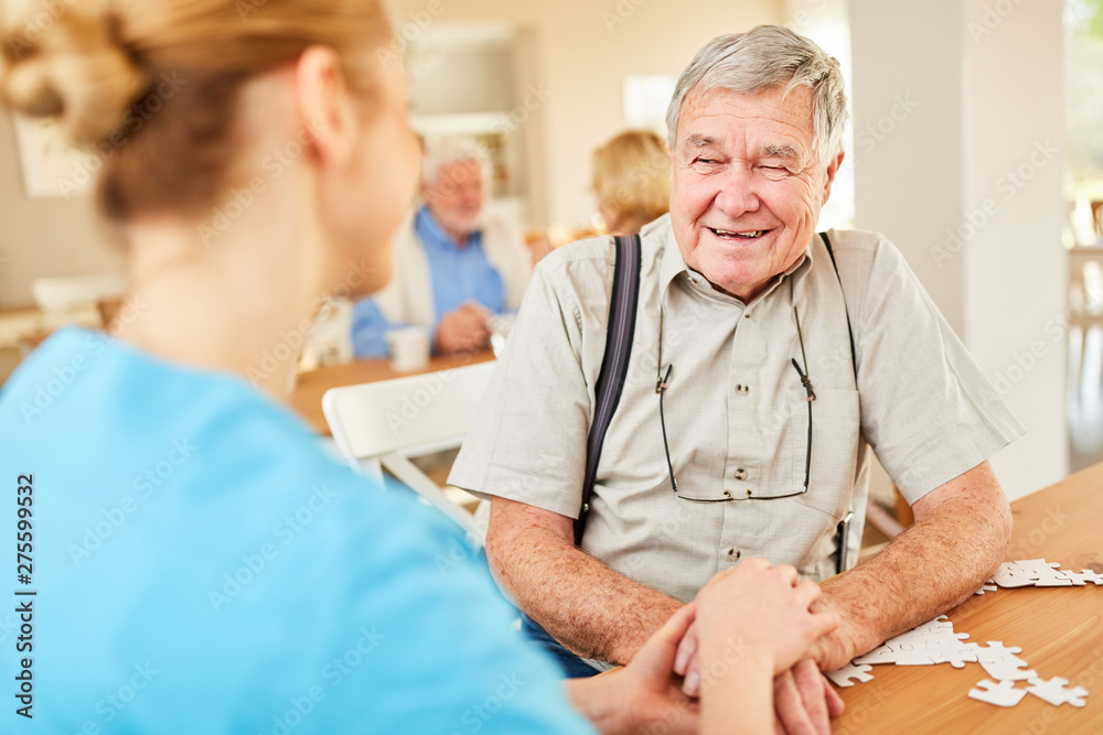 Nurse holds the hands of a senior Nurse holds the hands of a senior