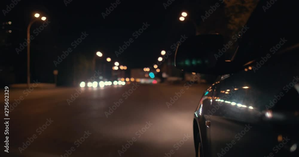 Driving a car through the night city. Shooting from the left side of the car. Driving a car through the night city. Shooting from the left side of the car.