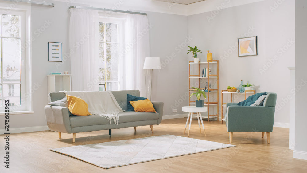 Fototapeta premium Shot of a Bright Cozy Modern Apartment with Big Windows, Decorations and Stylish Furniture.