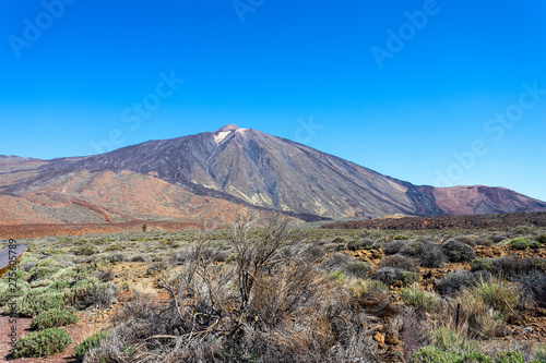 View of Volcano El Teide with volcanic rocks in The National Park of Las Canadas del Teide. Best place to visit and walk in Tenerife Canary Islands Spain.