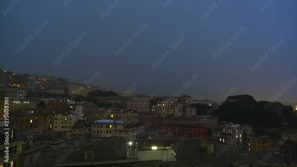 Evening view of Genoa port with thunderstorm, Italy Evening view of Genoa port with thunderstorm, Italy