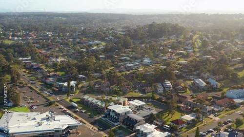 Aerial, reverse, drone shot over the Mollymook village, on a sunny, summer day, in Shoalhaven region, New South Wales, Australia photo