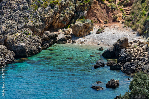 The crystal clear waters waters of Cala Beretta in the Oasi dello Zingaro natural reserve, San Vito Lo Capo, Sicily