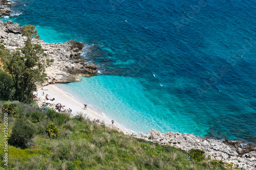 Oasi dello Zingaro natural reserve, San Vito Lo Capo, Sicily - April 4, 2018: tourist at the paradise beach of Cala dell'Uzzo