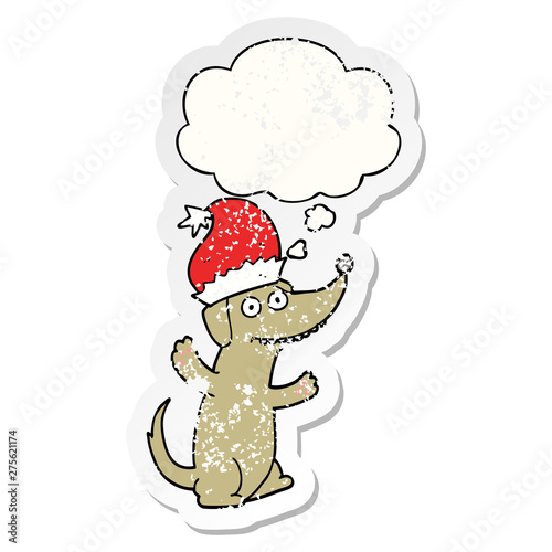 cute christmas cartoon dog and thought bubble as a distressed worn sticker