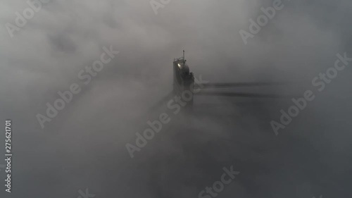 Aerial view of Moskovsky Bridge in Kiev in dense fog, 4k video. Moscow bridge