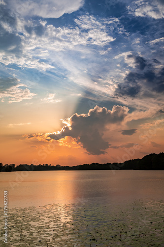 Calm sunset at lake with su...