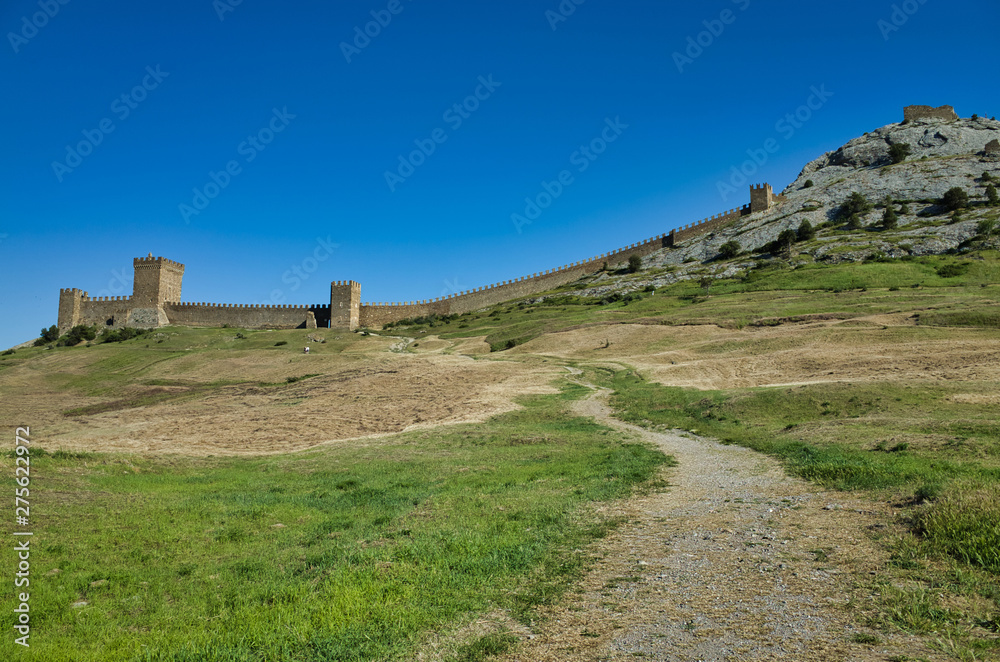 Sudak, Crimean Republic, Russia - May 29, 2017: Genoese fortress. Part of the walls of the ancient fortress in Sudak. Stone fortress wall on the mountain