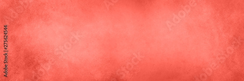 Abstract cement concrete background. Grunge texture, wallpaper. Living coral color of year 2019. Top view, copy space. Banner photo