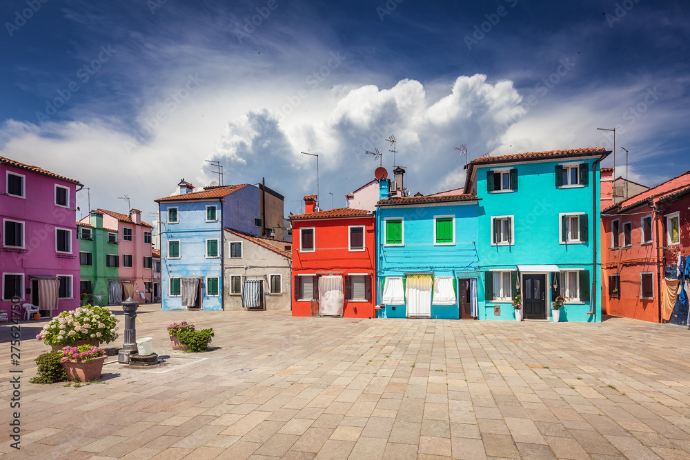 Multicolored houses on Burano island, Venice, Italy, on a summer day. Architecture and travel background.