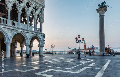 Doge's Palace and San Marco in Venice at sunrise. Scenic travel background. © Funny Studio