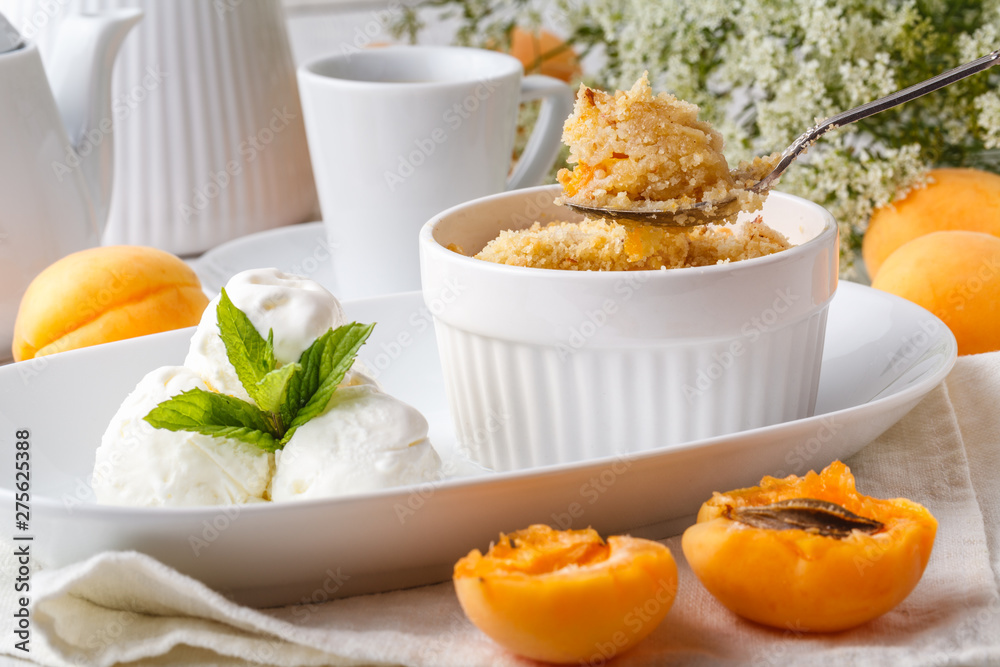 Apricot crumble topping vanilla ice cream serve in caffe Apricot crumble topping vanilla ice cream serve in caffe
