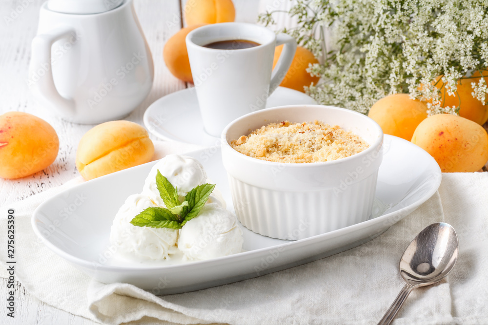 Crumble apricot pie on white table, morning dessert Crumble apricot pie on white table, morning dessert