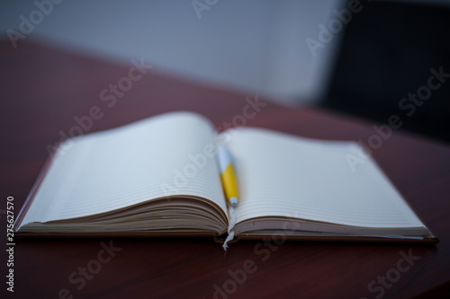 open book on wooden table