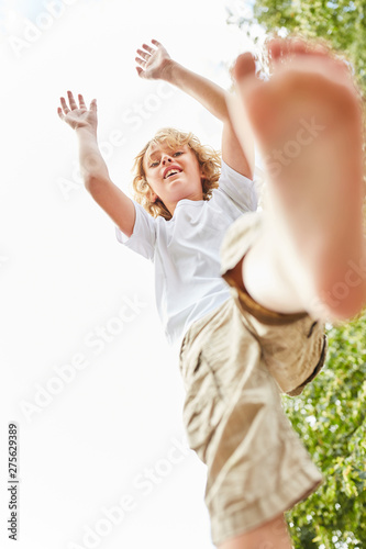 Boy balances skillfully while playing