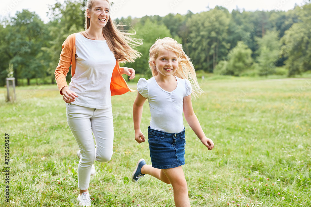 Fototapeta premium Girl makes a race with her mother