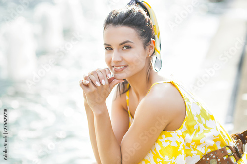 Φωτογραφία Attractive young woman wearing kerchief in her hair