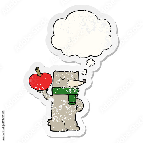 cartoon bear with apple and thought bubble as a distressed worn sticker